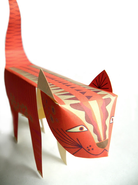 Downloadable paper sculpture of a tiger cat. Cut out fold and glue.