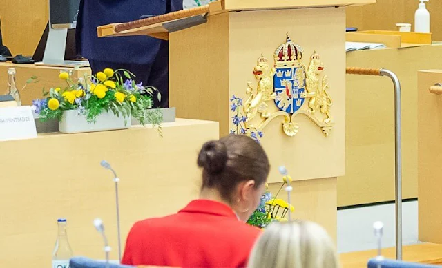 Crown Princess Victoria wore a Paris gold buttons single-breasted red blazer by The Extreme Collection. Extreme Collection trousers