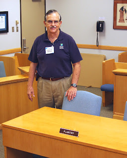 SHSU Alumnus Dr. James Benson built a courtroom in a classroom at the University of Houston - Clear Lake.