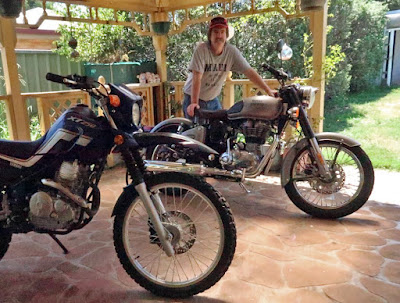 Graham Warrender with two motorcycles.