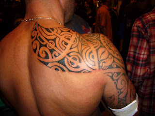 tribal tattoos on arm and shoulder