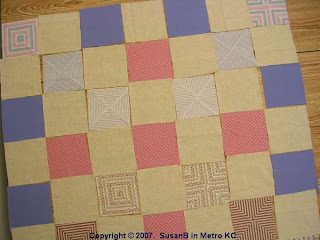squares arranged into quilt top