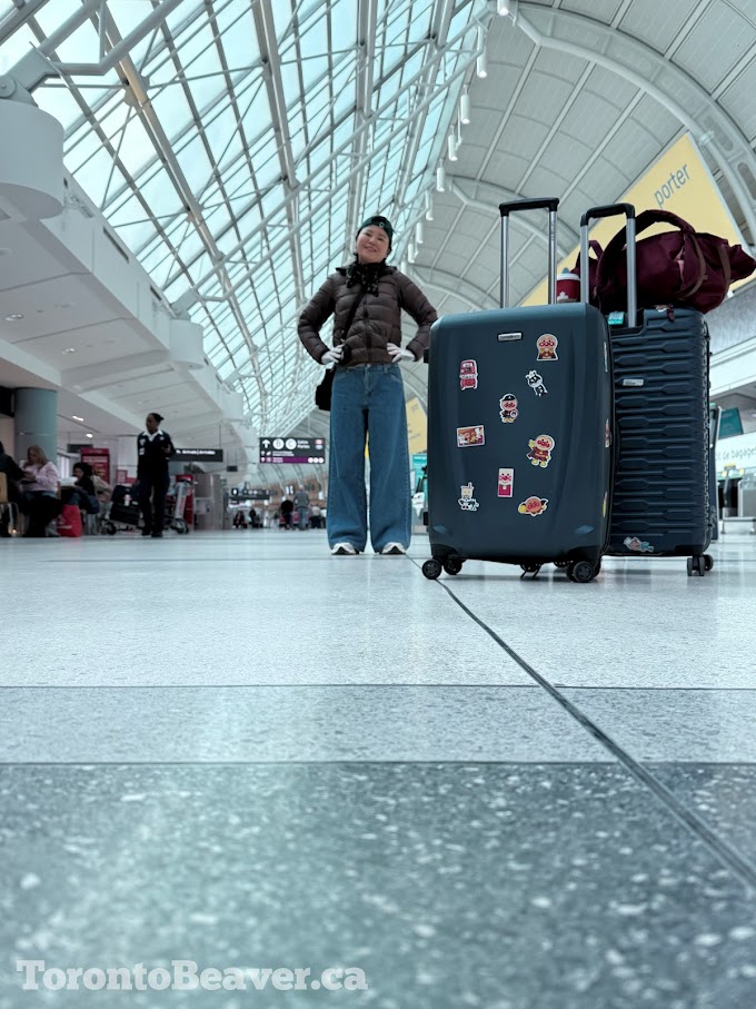 Human Poses For A Picture Inside Toronto Pearson Airport Terminal 3