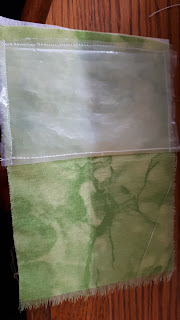 The inner piece of fabric with the plastic pocket stitched onto it.