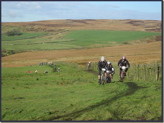 Cyclists ascending towards Shackleton Knoll