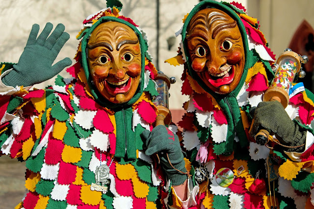 A Man with Scary Mask and Traditional Costumes