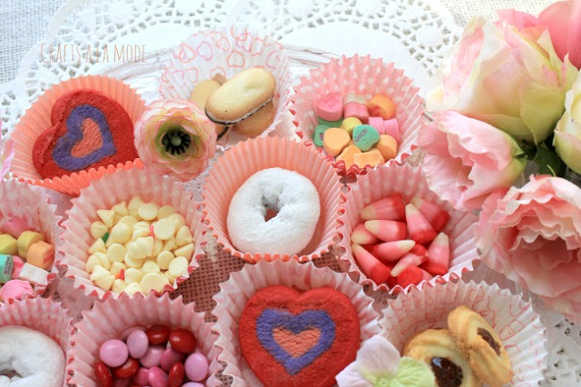 Candy and cookies in Valentine cupcake papers