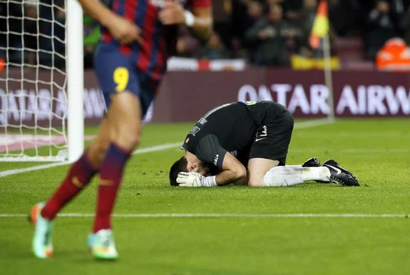 Real Sociedad goalkeeper Eñaut Zubikarai reacts after conceding an own goal against Barcelona