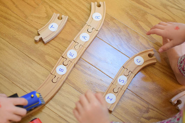 Train Track Word Building- Fun and easy literacy activity inspired by the book Old Tracks New Tricks. Great preschool or kindergarten activity for teaching sight words, phonics, or CVC words to beginning readers.