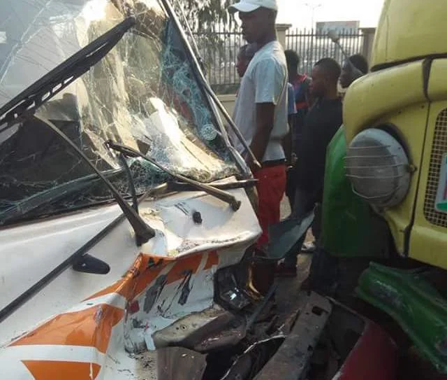 Photos: Passengers escape death as bus rams into truck in Anambra