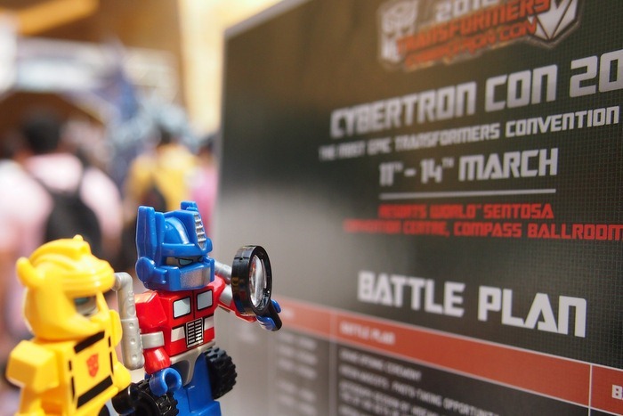 Optimus Prime and Bumblebee inspecting Battle Plans