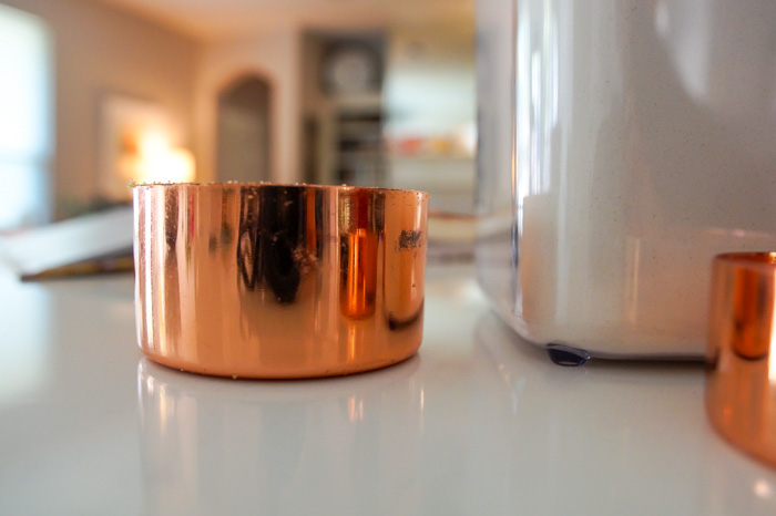 copper measuring cup on kitchen counter