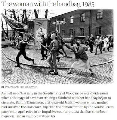 screenshot of a woman hitting a neo-Nazi demonstrator with her handbag