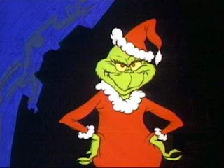 The grinch dressed as santa