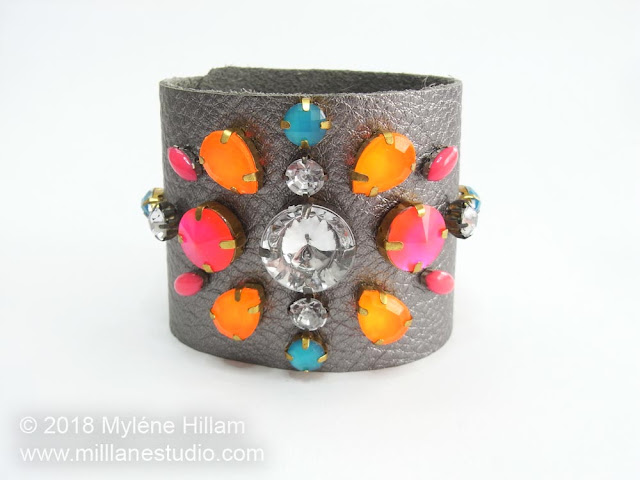 Pewter coloured leather cuff featuring neon bright and crystal rhinestones