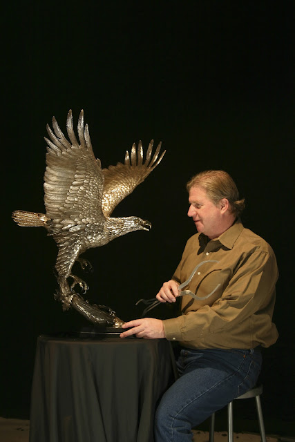 Michael Maiden and silver eagle sculpture