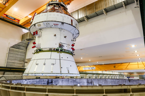 Inside the O&C Building at NASA's Kennedy Space Center in Florida, the Orion capsule for Artemis 2 is about to enter the west altitude chamber to undergo electromagnetic interference and compatibility testing.