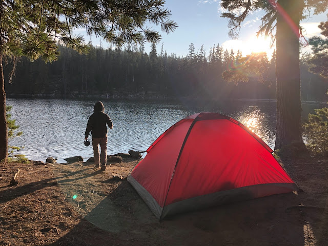 tent camping by a lake