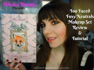 Ultima Beauty holding Too Faced Foxy Neutrals Makeup Set box. Text reads "Ultima Beauty presents Too Faced Foxy Neutrals Makeup Set Tutorial & Review"