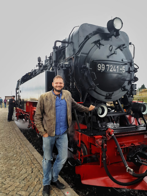 The Social Traveler with the steam train at Brocken the top of the Harz mountains