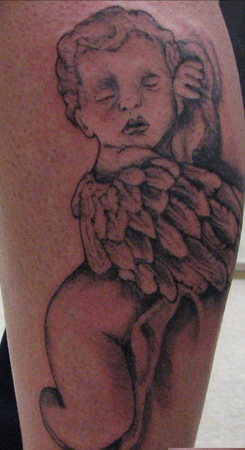 Adorable baby angel tattoo.