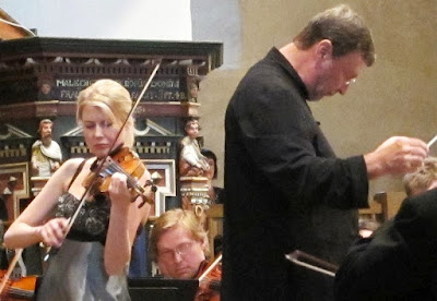 An orchestra performing the Sibelius Violin Concerto,