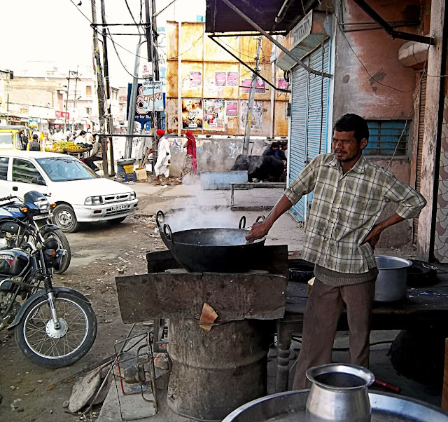 outdoor cooking by eatery