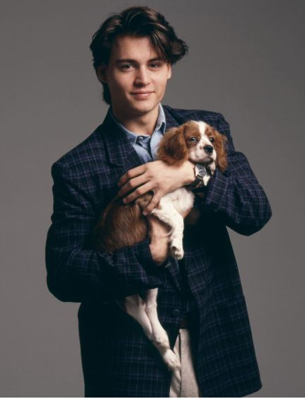 So, please accept this photo of young Johnny Depp holding a puppy. So, please accept this photo of young Johnny Depp holding a puppy.