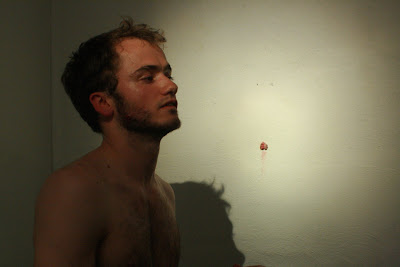 Performance artist Adrian Parsons with his foreskin hanging on the wall