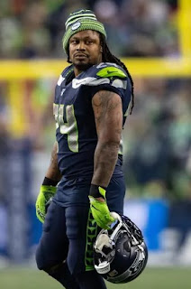 Marshawn Lynch posing for the picture