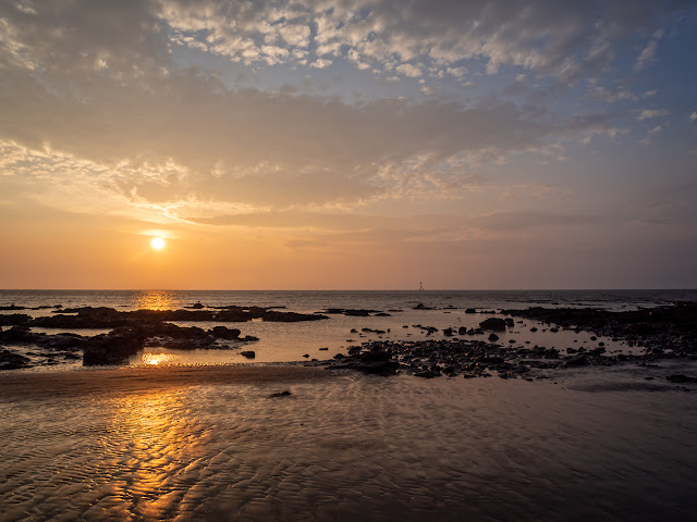 Photo of a wider view of the sun going down over the Solway Firth