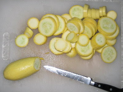 Preparing squash in 1/4 inch slices for drying.