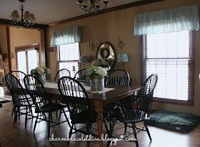 Farmhouse kitchen eating area with barn wood table