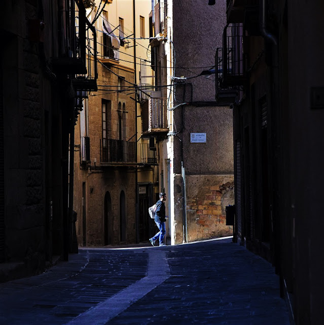 young man walking alone cardona spain streets europe