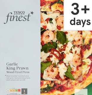 A photo of a Tesco Finest pizza box. It's a garlic and king prawn wood fired pizza.