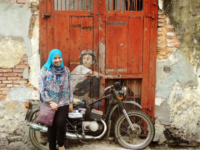 boy on motorcycle mural arts armenian street pulau pinang