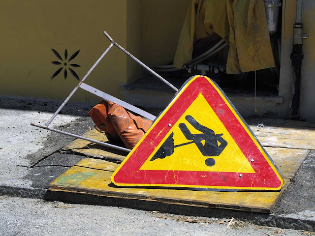 Knocked over sign of men at work, Livorno