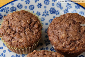 close up image of banana cocoa cookie butter oatmeal muffins on a plate