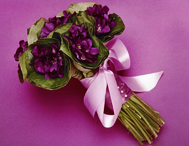  had a violet wedding bouquet like this one surrounded by leavesjust 