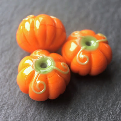 Handmade lampwork glass pumpkin beads by Laura Sparling