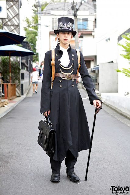 Men's Steampunk Fashion: Harajuku Aristocrat. Wealthy upper class steampunk character, part of the aristocracy, a lord. Long coat, top hat, mask, cane, leather bag.