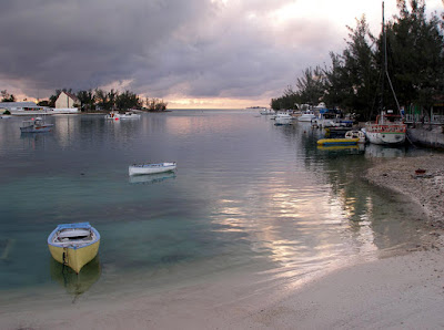 Sunset over the sea with boats