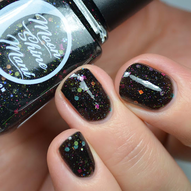 black nail polish with rainbow glitter swatch