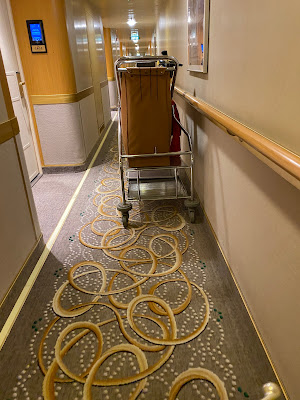 Island Princess cleaning cart in hallway