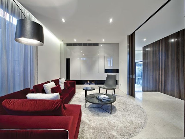 Photo of living room with red sofa in amazing dream home in Melbourne