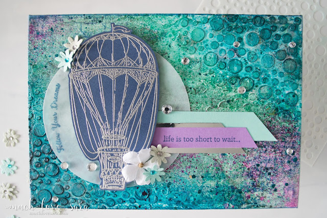 This mixed media canvas was created using a variety of products from Fun Stampers Journey.  Rhinestones, Splashes and Silks combine on the colorful and sparkling background.  Featuring the Blue Skies Stamp Set, along with a sentiment from the Text Happy Stamp Set.  