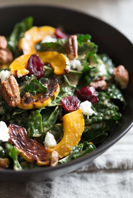 Kale Salad with Roasted Delicata Squash, Chevre, Dried Cranberries and Spiced Pecans