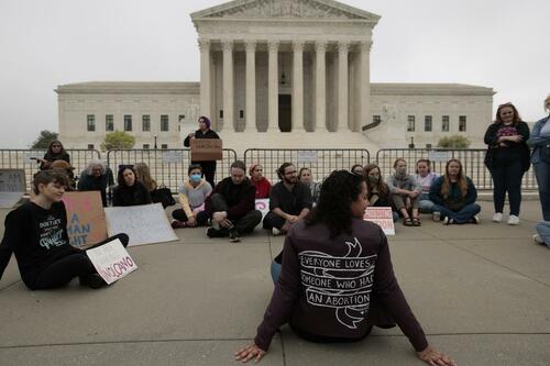 Protesters gather outside the U.S. Supreme Court on May 03, 2022, in Washington, DC, after a leaked initial draft majority opinion obtained by Politico, in which Supreme Court Justice Samuel Alito allegedly wrote for the Court's majority that Roe v. Wade should be overturned