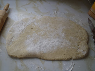 The dough, rolled flat