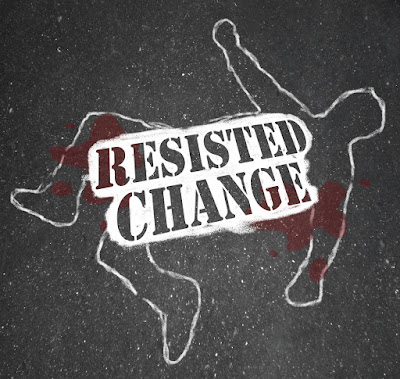 A chalk outline of a victim on the street with a sign saying, "Resisted Change"